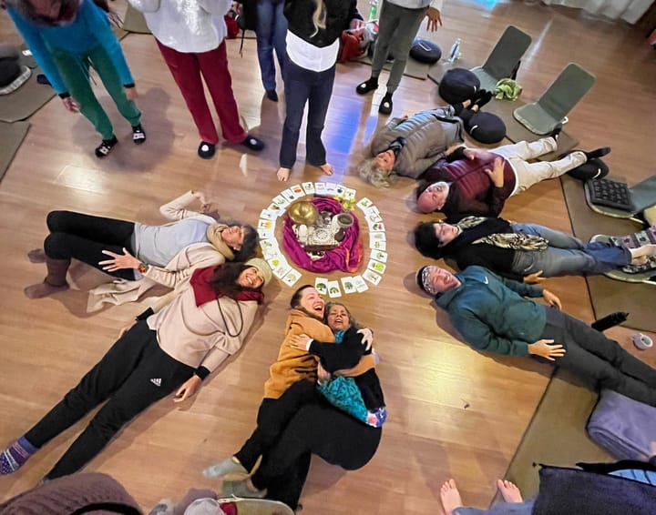 A group of people gathering around an altar in a spiral shape way. Regenerative Buisness Hub, Brazil